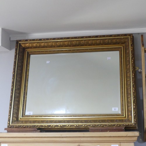 472 - A modern Gilt-wood rectangular Wall Mirror, with carved decoration and bevelled glass, W 90cm x H 69... 