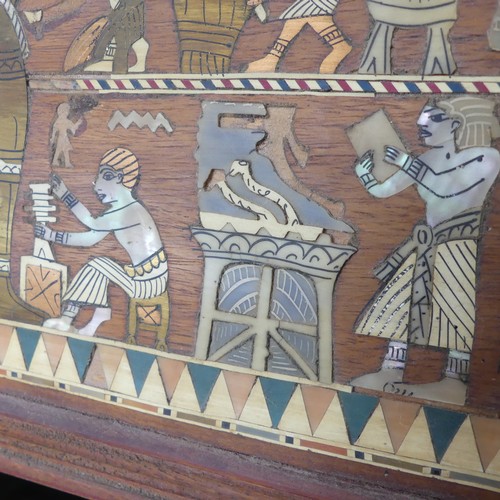 365 - An early 20thC Egyptian Revival Casket, of sarcophagus shape, with inlaid decoration, the hinged lid... 