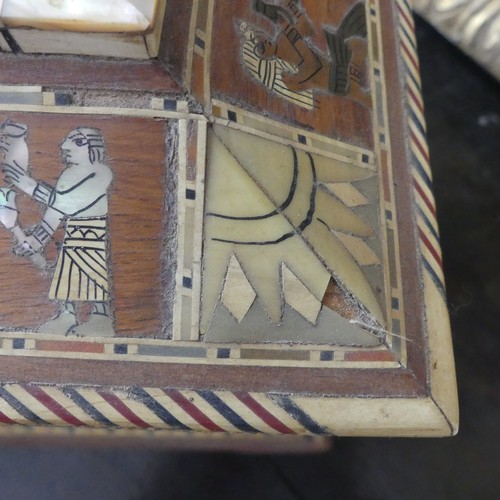 365 - An early 20thC Egyptian Revival Casket, of sarcophagus shape, with inlaid decoration, the hinged lid... 