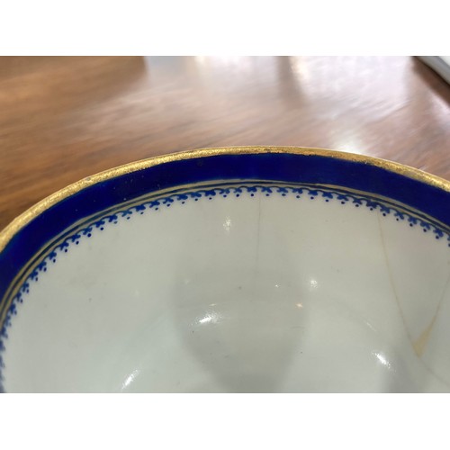 144 - An 18thC Chinese export armorial porcelain Teabowl and Saucer, decorated with gilt and blue banding ... 