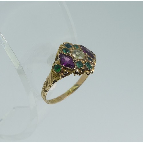 A Victorian 15ct gold Ring, the shank with engraved decoration and the front a cluster of a central off white sapphire, two amethysts and eight small emeralds, (these colours later being adopted by the Suffragette movement) Size N½, approx total weight 2.2g.