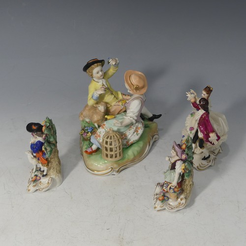 92 - A Dresden porcelain Figural Group, depicting a gentleman reclining next to a lamb with the lady feed... 