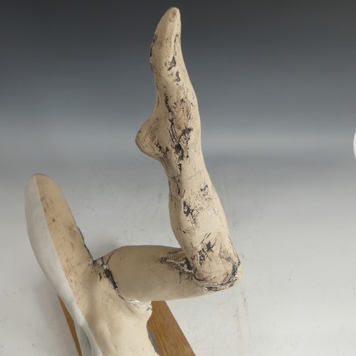 492 - A Paul Donovan studio pottery 'Ballerina' sculpture, signed and dated 14 to arm, raised on a wooden ... 