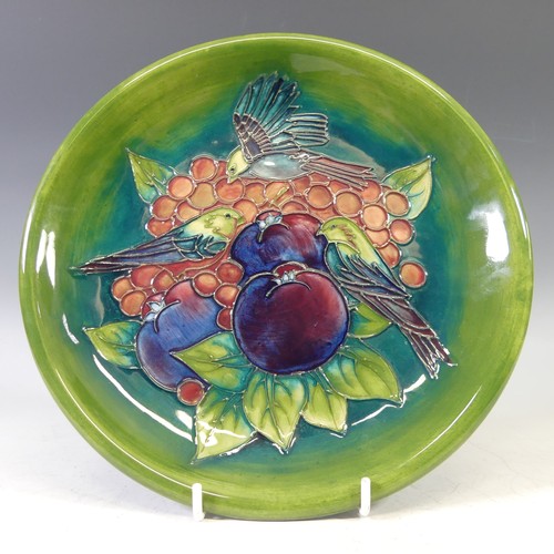 A Moorcroft 'Finch' pattern Plate, with tubelined decoration on green ground, factory marks to base, diameter 26cm.