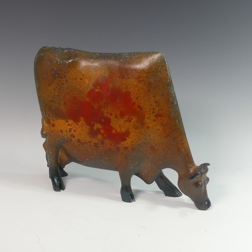 140 - Lawson E. Rudge (b. 1936), a cold cast bronze resin sculpture of a Grazing Cow, H 34cm.Provenance: f... 