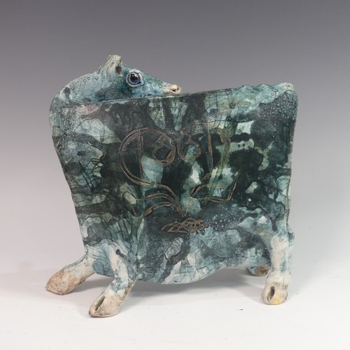 119 - Lawson E. Rudge (b. 1936), a raku fired studio pottery sculpture of a Cow, with textured blue glaze ... 