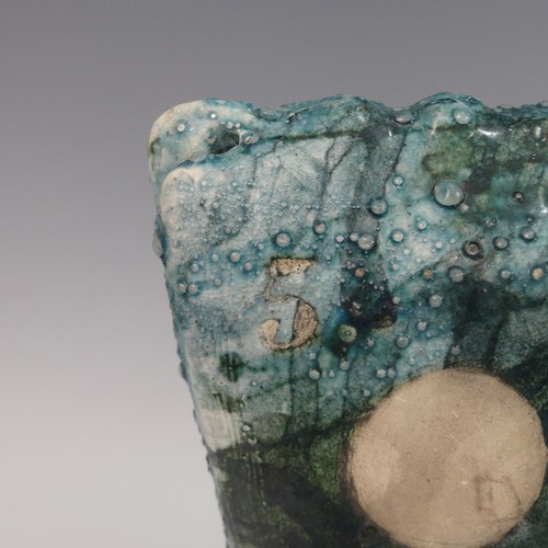 119 - Lawson E. Rudge (b. 1936), a raku fired studio pottery sculpture of a Cow, with textured blue glaze ... 