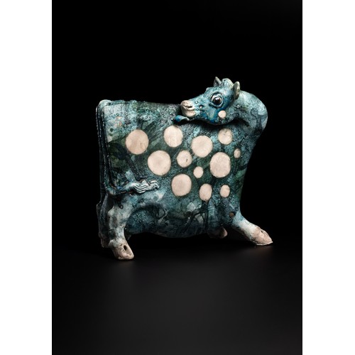 119 - Lawson E. Rudge (b. 1936), a raku fired studio pottery sculpture of a Cow, with textured blue glaze ... 