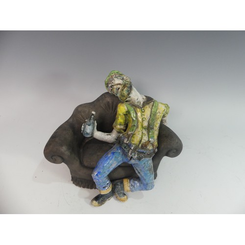 129 - Lawson E. Rudge (b. 1936), a raku fired studio pottery sculpture of a Drunkard on Sofa, H 23cm.Prove... 