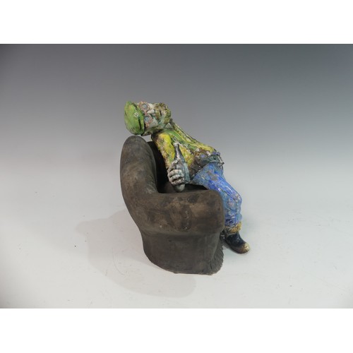 129 - Lawson E. Rudge (b. 1936), a raku fired studio pottery sculpture of a Drunkard on Sofa, H 23cm.Prove... 