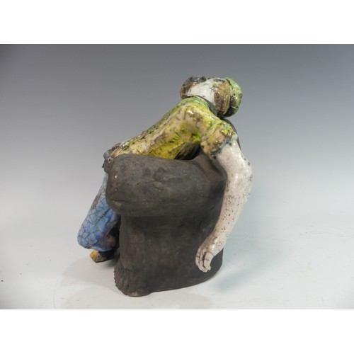 129 - Lawson E. Rudge (b. 1936), a raku fired studio pottery sculpture of a Drunkard on Sofa, H 23cm.Prove... 