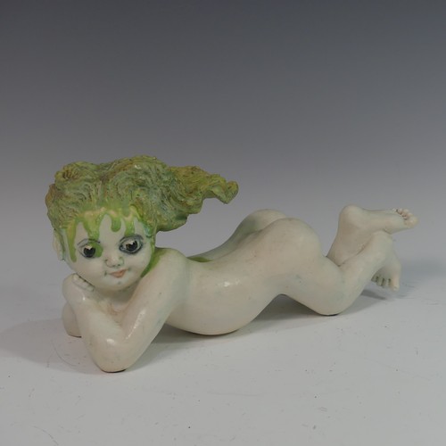 132 - Lawson E. Rudge (b. 1936), a raku fired studio pottery sculpture of a Baby, modelled laying on her s... 