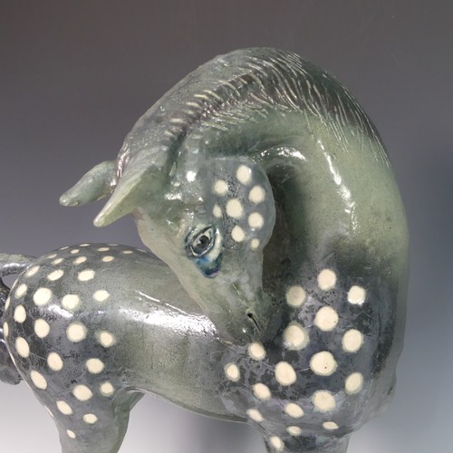 62 - Lawson E. Rudge (b. 1936), a raku fired studio pottery sculpture of a Tang Horse, crack to base and ... 