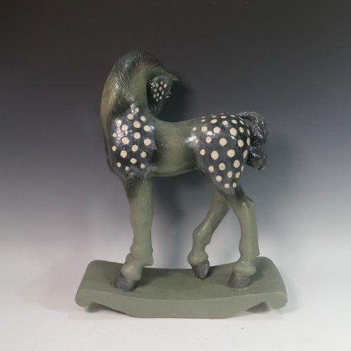 62 - Lawson E. Rudge (b. 1936), a raku fired studio pottery sculpture of a Tang Horse, crack to base and ... 