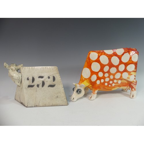 121 - Lawson E. Rudge (b. 1936), a raku fired studio pottery sculpture of a square Cow, numbered 252, some... 