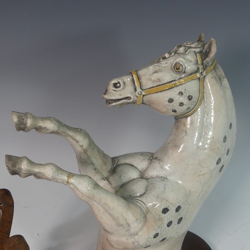 67 - Lawson E. Rudge (b. 1936), a raku fired studio pottery sculptural Horse Wall Plaque, one leg repaire... 