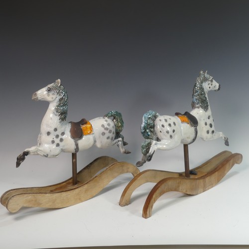 68 - Lawson E. Rudge (b. 1936), a pair of raku fired studio pottery sculptures of Carousel Horses, one wi... 