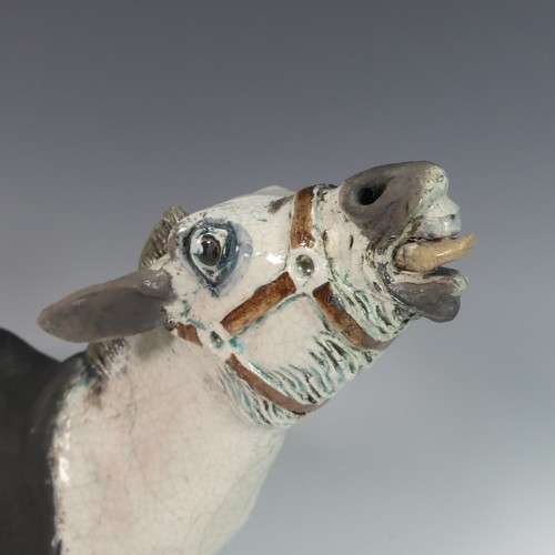 123 - Lawson E. Rudge (b. 1936), a raku fired studio pottery sculpture of a Donkey, numbered 5 to saddle c... 