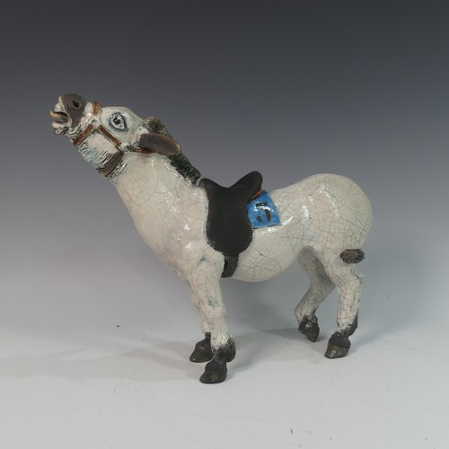 123 - Lawson E. Rudge (b. 1936), a raku fired studio pottery sculpture of a Donkey, numbered 5 to saddle c... 