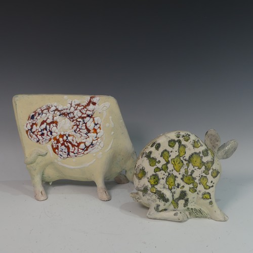 77 - Lawson E. Rudge (b. 1936), a studio pottery sculpture of a Grazing Cow, H 26cm, together with a roun... 