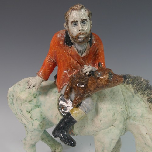 81 - Lawson E. Rudge (b. 1936), a raku fired studio pottery sculpture of a Grazing Horse, with self portr... 