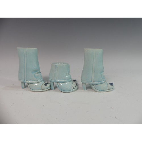 86 - Lawson E. Rudge (b. 1936), a pair of blue glazed studio pottery Salt and Pepper Pots, modelled as fe... 