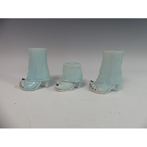 86 - Lawson E. Rudge (b. 1936), a pair of blue glazed studio pottery Salt and Pepper Pots, modelled as fe... 