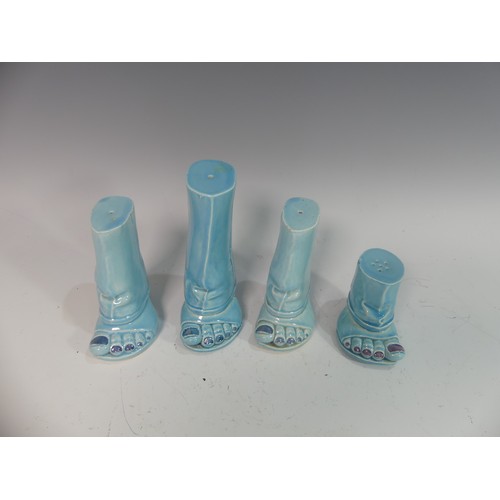 88 - Lawson E. Rudge (b. 1936), a pair of blue glazed studio pottery Salt and Pepper Pots, modelled as fe... 