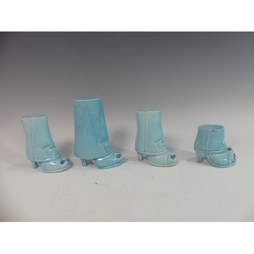 88 - Lawson E. Rudge (b. 1936), a pair of blue glazed studio pottery Salt and Pepper Pots, modelled as fe... 