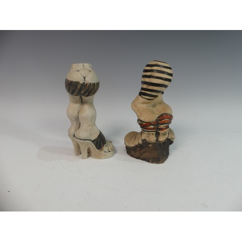 92 - Lawson E. Rudge (b. 1936), a pair of studio pottery Salt and Pepper Pots, in the form of rugby boots... 