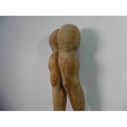 103 - Lawson E. Rudge (b. 1936), a carved wooden sculpture 'Legs and Arms', carved as a pair of legs weari... 