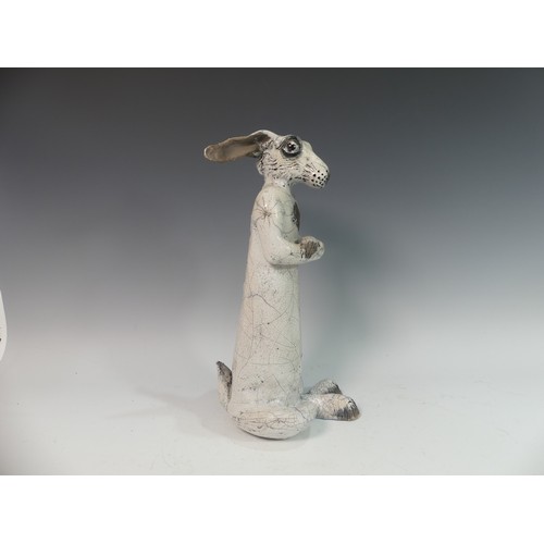 104 - Lawson E. Rudge (b. 1936), a raku fired studio pottery sculpture of a Hare, modelled standing uprigh... 