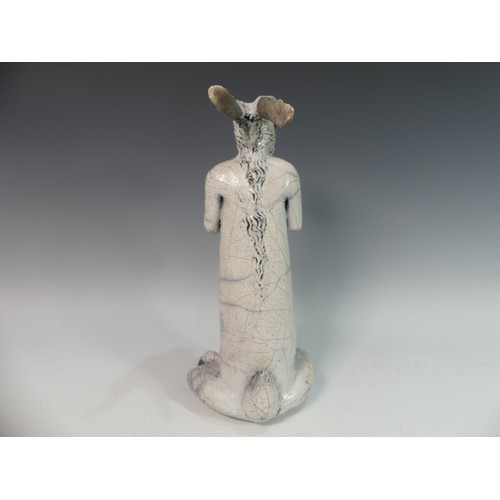 104 - Lawson E. Rudge (b. 1936), a raku fired studio pottery sculpture of a Hare, modelled standing uprigh... 