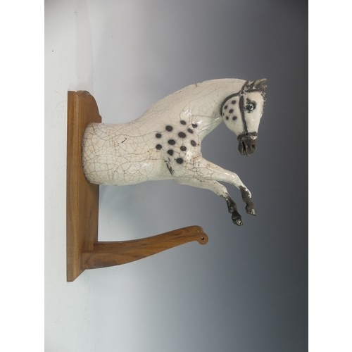 107 - Lawson E. Rudge (b. 1936), a raku fired studio pottery sculptural Horse Wall Plaque, W x D x H cm.Pr... 