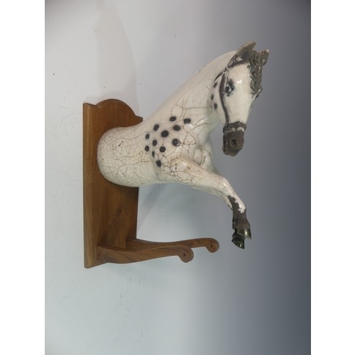 107 - Lawson E. Rudge (b. 1936), a raku fired studio pottery sculptural Horse Wall Plaque, W x D x H cm.Pr... 