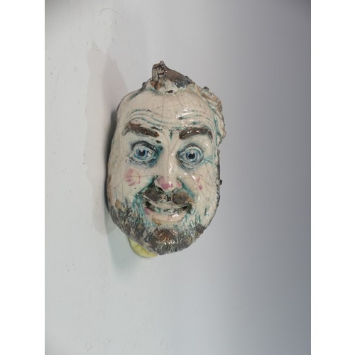 108 - Lawson E. Rudge (b. 1936), a raku fired studio pottery Self Portrait Plaque, modelled as the Man in ... 