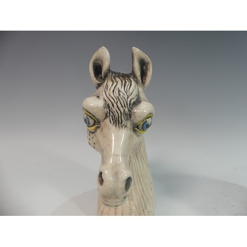 115 - Lawson E. Rudge (b. 1936), a raku fired studio pottery Horse Head, signature to base, H 22cm, togeth... 