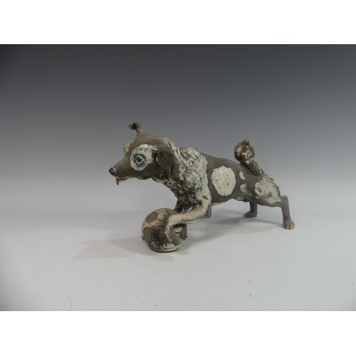 116 - Lawson E. Rudge (b. 1936), a raku fired studio pottery sculpture of a Border Collie, modelled playin... 