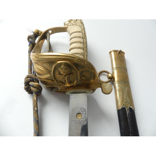 411 - A 20thC Elizabeth II Naval ceremonial sword, gilt brass hilt with lions head, Naval crest and ornate... 