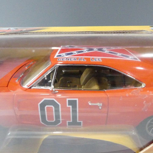 213 - A boxed Dukes of Hazard General Lee 1969 charger, American Muscle, 1:18 scale diecast model with bla... 