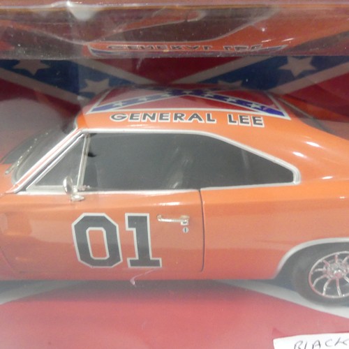 213 - A boxed Dukes of Hazard General Lee 1969 charger, American Muscle, 1:18 scale diecast model with bla... 