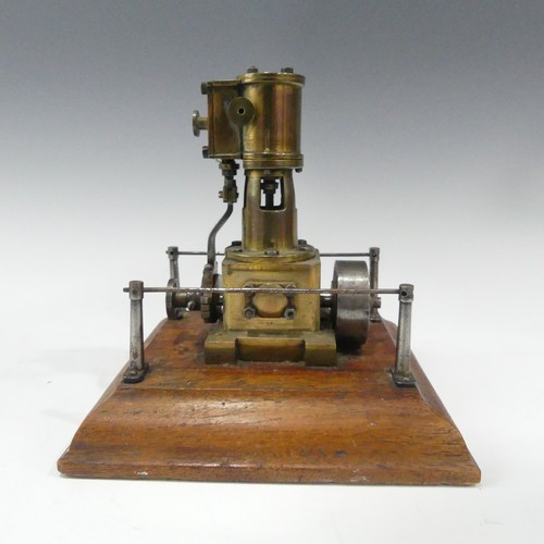 214 - An apprentice piece Stationary Steam engine, on wooden stand dated 1938 together with a Mamod tracti... 