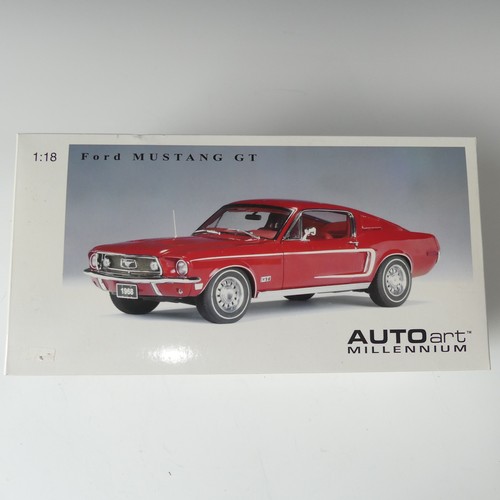 217 - An Auto Art 1:18 scale model of a Ford Mustang GT, red with white stripe, boxed.