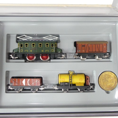 219 - A Marklin HO gauge boxed double train set,  Jubilee 50th anniversary '50 Jahre Marklin HO', comprisi... 