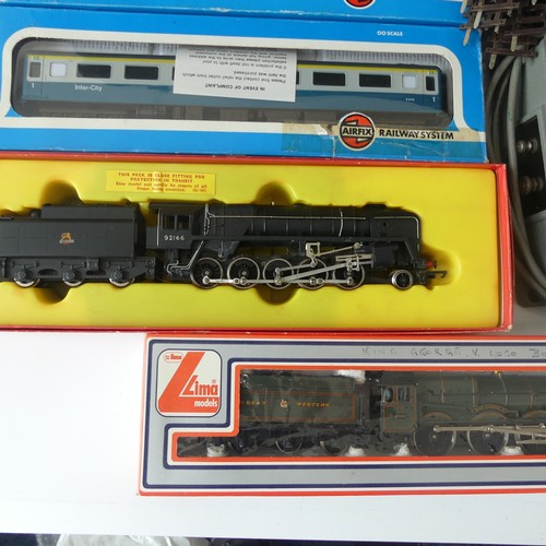 231 - A quantity of OO gauge model railway  boxed examples to include Hornby R550 black livery Loco and Ta... 