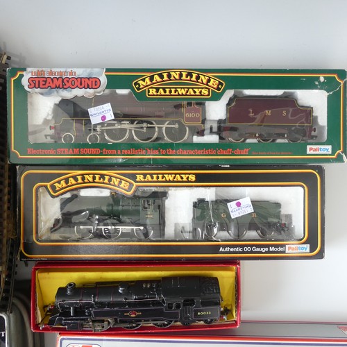 231 - A quantity of OO gauge model railway  boxed examples to include Hornby R550 black livery Loco and Ta... 