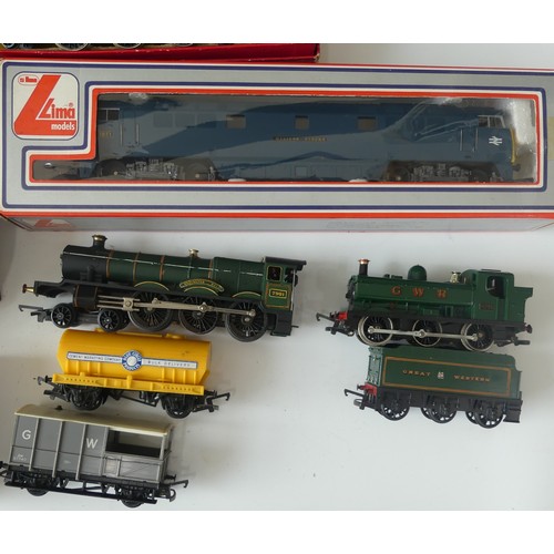 231 - A quantity of OO gauge model railway  boxed examples to include Hornby R550 black livery Loco and Ta... 