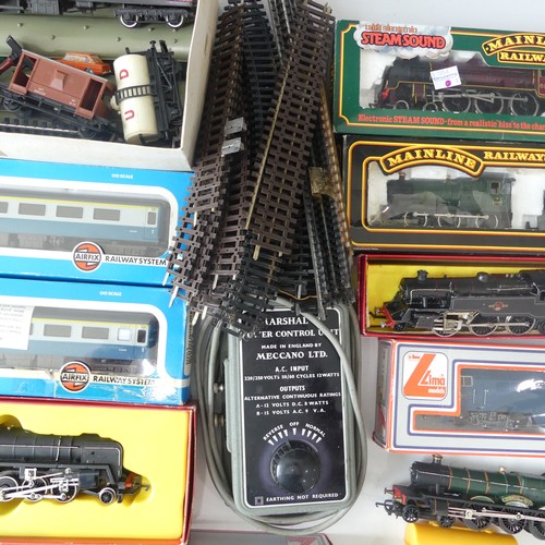 231 - A quantity of OO gauge model railway  boxed examples to include Hornby R550 black livery Loco and Ta... 