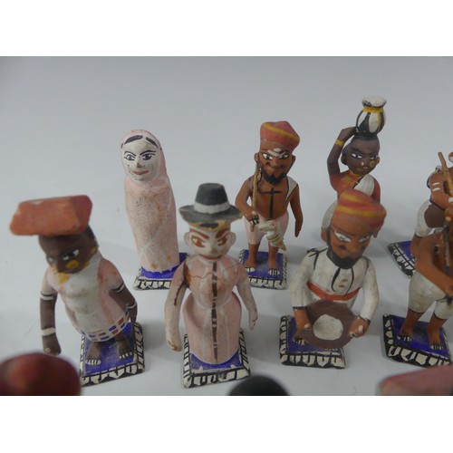 240 - A collection of vintage Indian painted carved wood figures, in a variety of types and traditional co... 