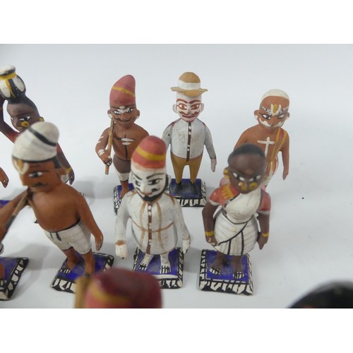 240 - A collection of vintage Indian painted carved wood figures, in a variety of types and traditional co... 